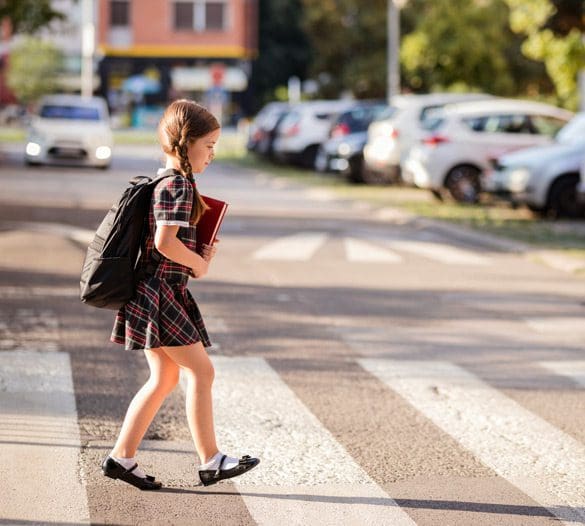 Girl-crossing-the-street-on-her-way-to-school Girl-crossing-the-street-on-her-way-to-school