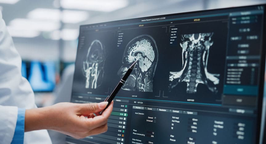doctor-pointing-to-spine-scans-on-a-screen
