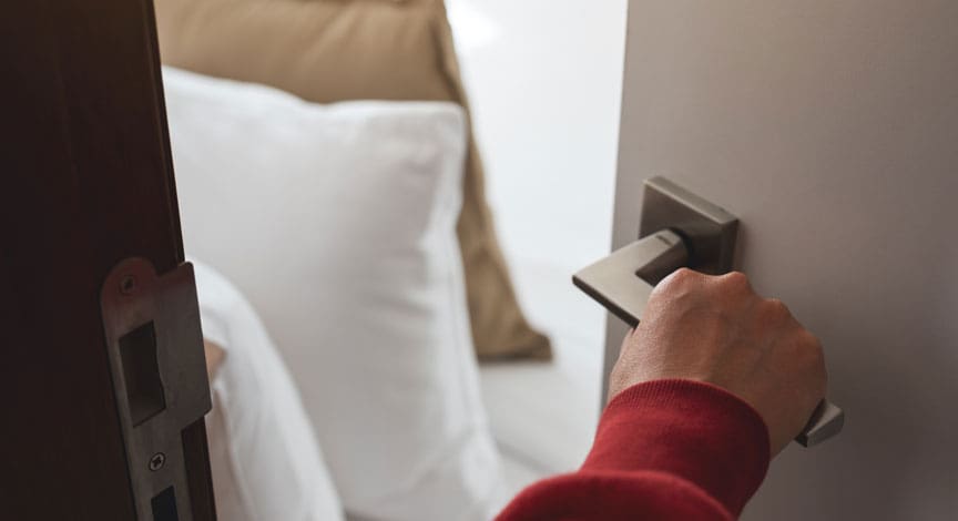 hand-pressing-a-hospital-bed-call-button